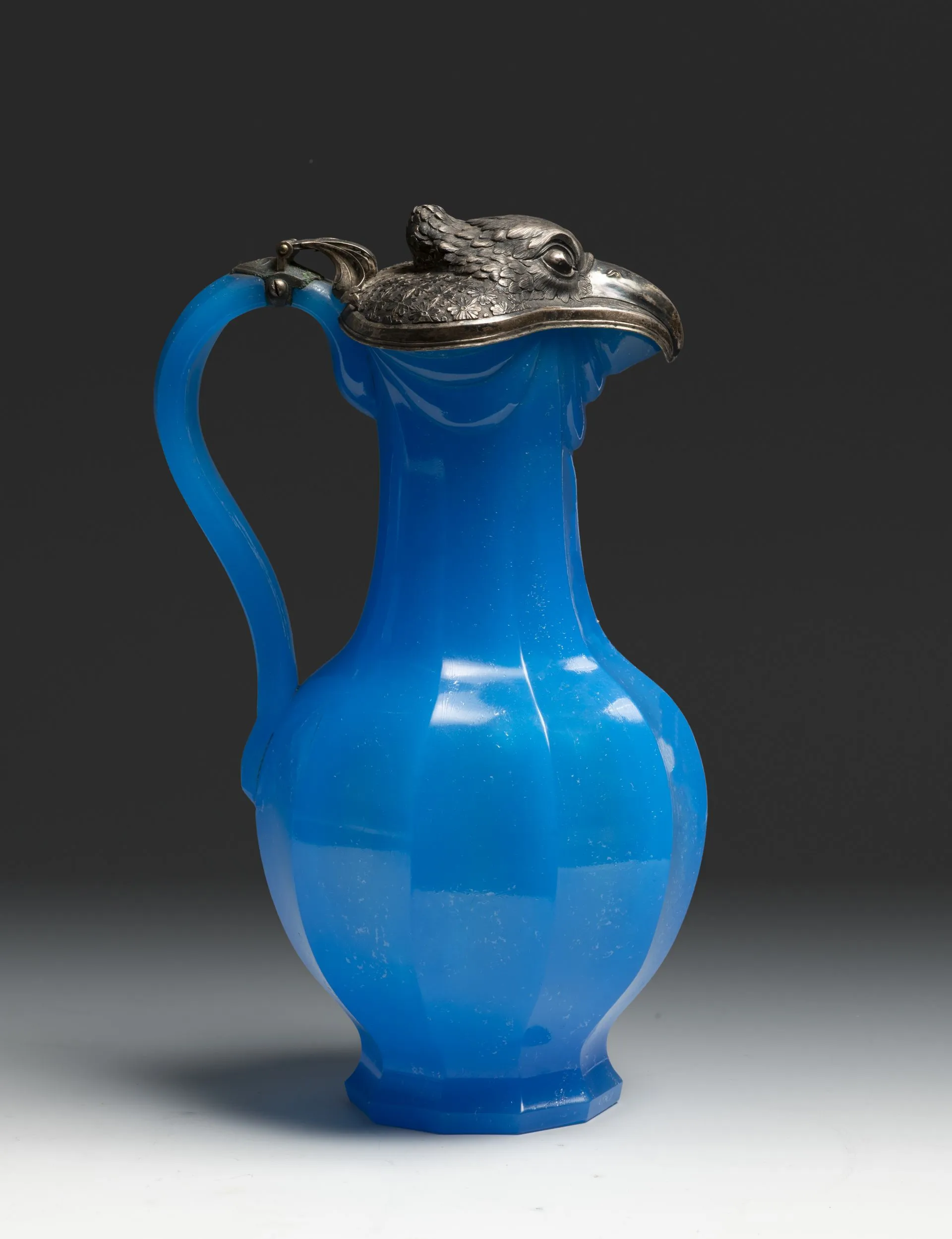 Pitcher with lid. Mid-19th century. Coloured (blue) glass, blowing, diamond cutting; metal, chasing