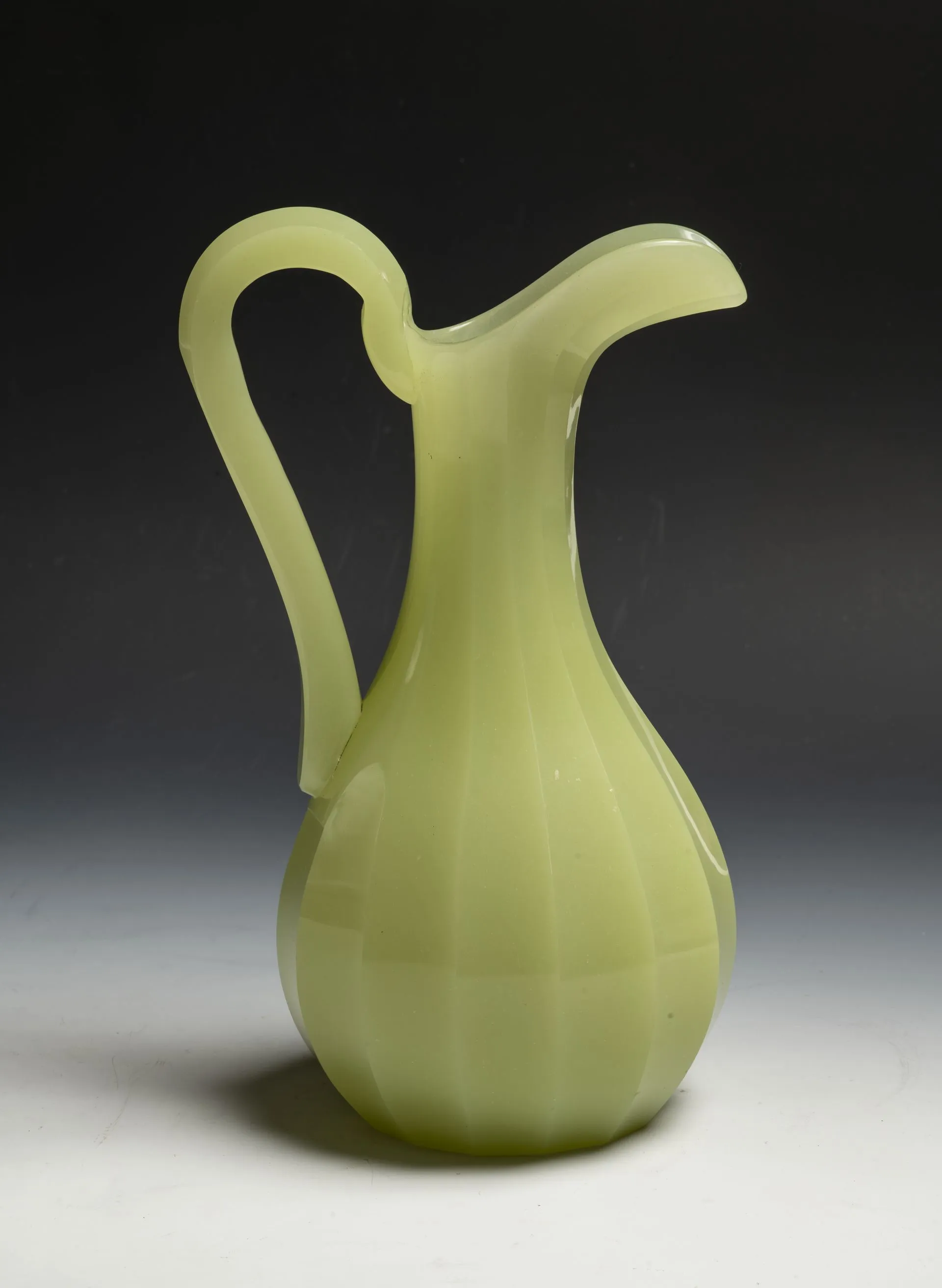 Perfume bottle with stopper. 19th century. Uranium glass, pressed